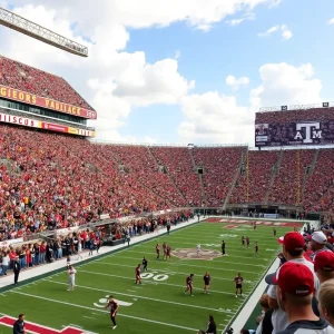 Fans cheering in a college football stadium during the Missouri Tigers vs Texas A&M Aggies game.