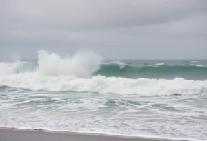 Coastal scene impacted by Hurricane Erin with heavy rain and rough seas